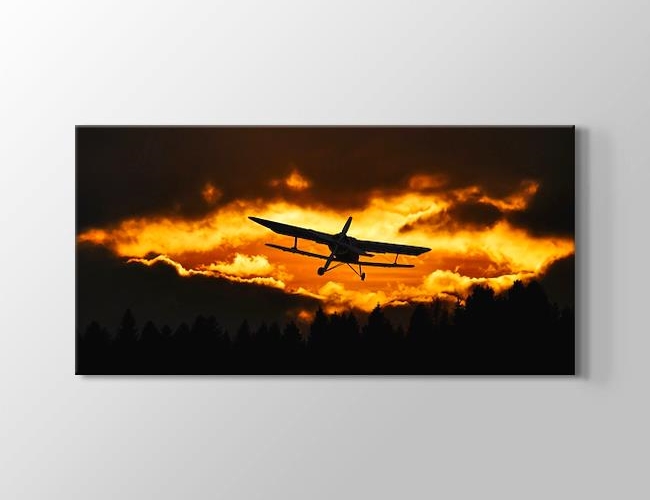 Gün Batımında Bulutlar Arasında Uçan Uçak Kanvas tablosu